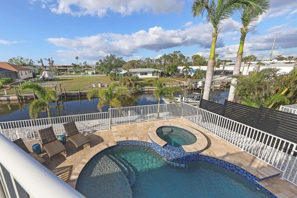 Gorgeous canal views and incredible pool deck overlooking the water