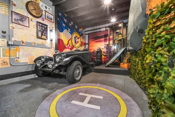 1930s SS Jaguar with a racing simulator and 2 PlayStation 5