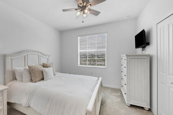 Queen bed in second bedroom with access to the guest bathroom