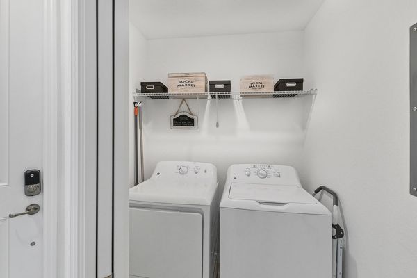 Full size washer and dryer in the laundry room in the unit