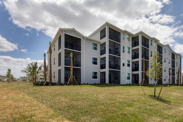 Back of the condo building by the pond