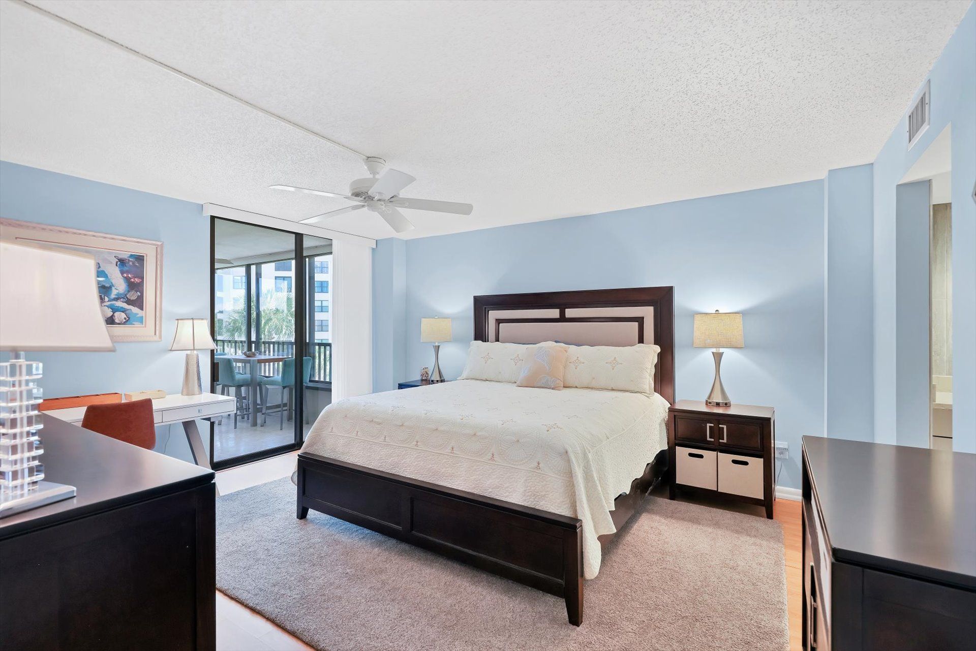 Primary bedroom with king bed, balcony access, en suite,  and 32" TV