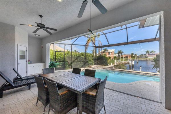 Spacious outdoor area with dining table overlooking the water (Boat lift not available)