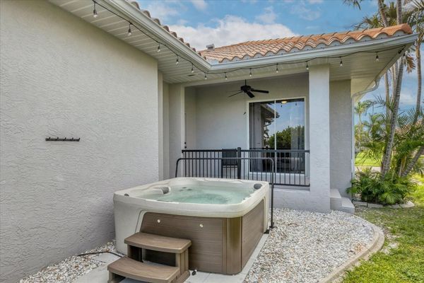 Standalone hot tub on the side of the house