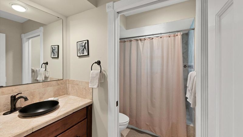 Second bathroom with combo tub and shower