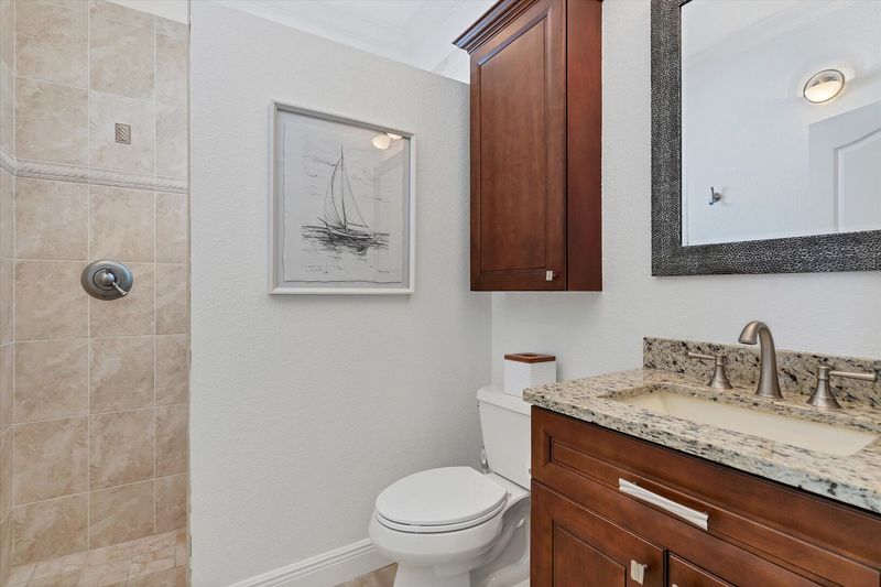 Shared bathroom has walk-in shower