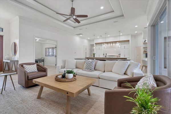 Beautiful open living area with ample seating, 65-inch Smart TV & dining table that converts to a tavern shuffleboard table