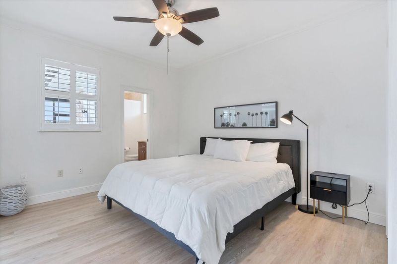 Guest Bedroom has a king bed, ensuite and patio access