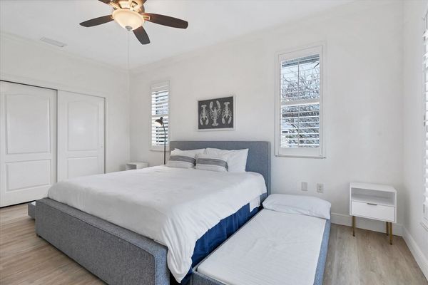 Guest bedroom has a king bed and two pullout twin trundle beds