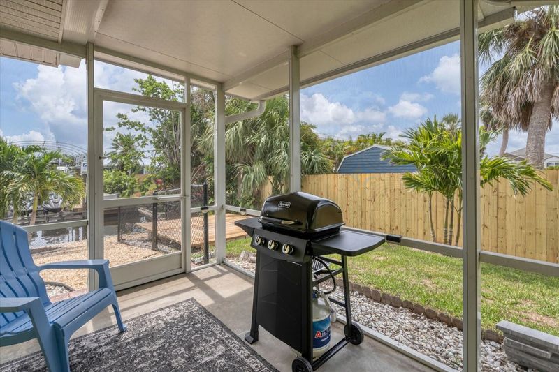 Side lanai with BBQ off the kitchen