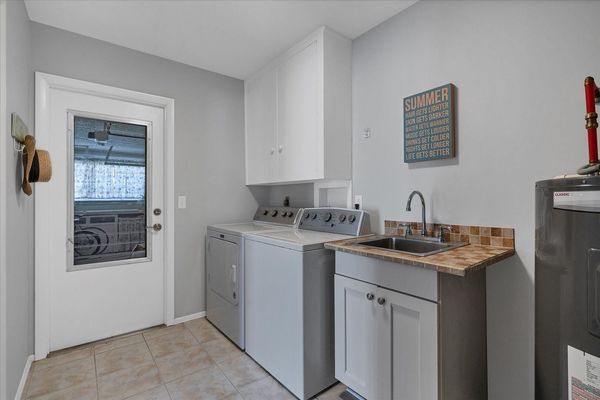 Laundry room with full size washer and dryer