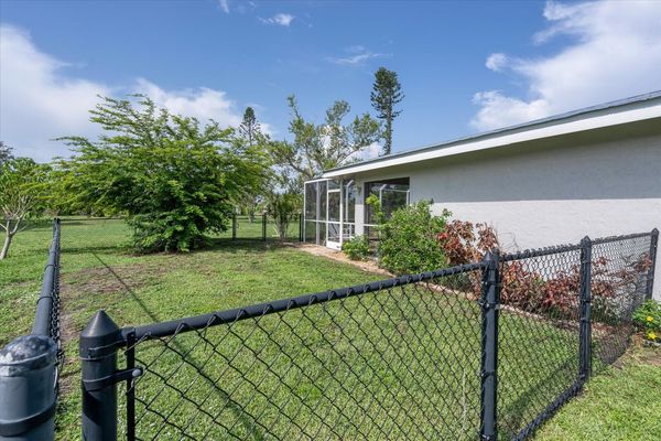 Backyard includes a large fenced in dog-run!