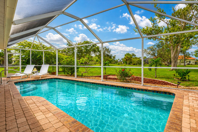 South facing pool with fully screened-in pool cage