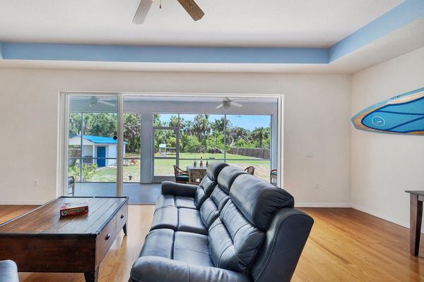 large sliding doors leading to screened-in lanai