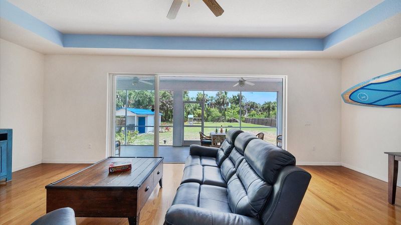 large sliding doors leading to screened-in lanai