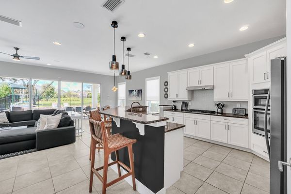 Sit down at the bar top whilst the family cooks up some home cooked meals