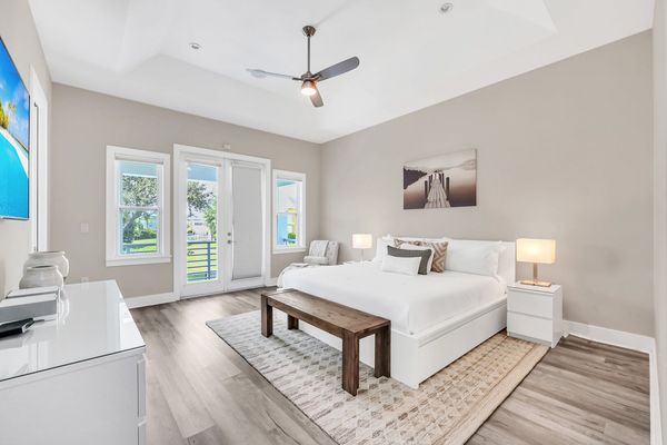 Retreat to the serene master bedroom, a spacious haven complete with furnishings and a tranquil ambiance