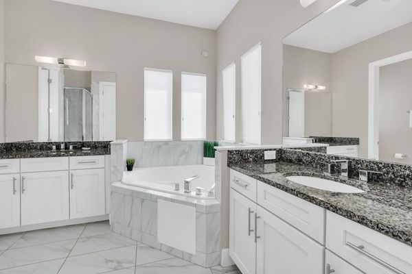 Refresh yourself in the modern shower area, featuring sleek fixtures and ample space for a rejuvenating experienc