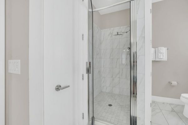 Enjoy the convenience of an en-suite bathroom featuring a walk-in shower for a refreshing start to your day