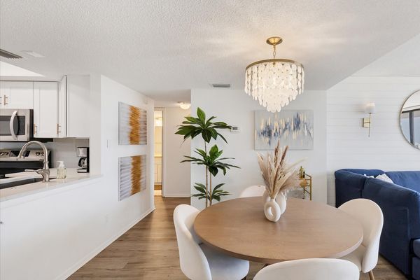 Dining area with hall leading to second bedroom