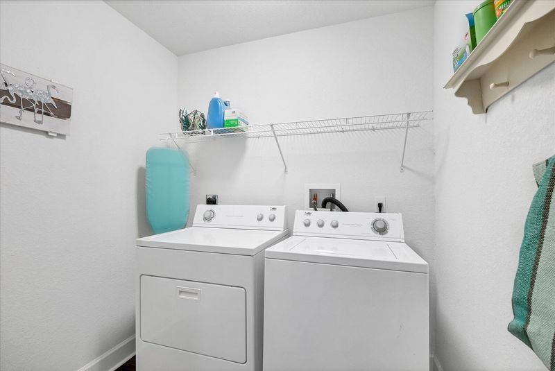 Laundry room with full size washer and dryer