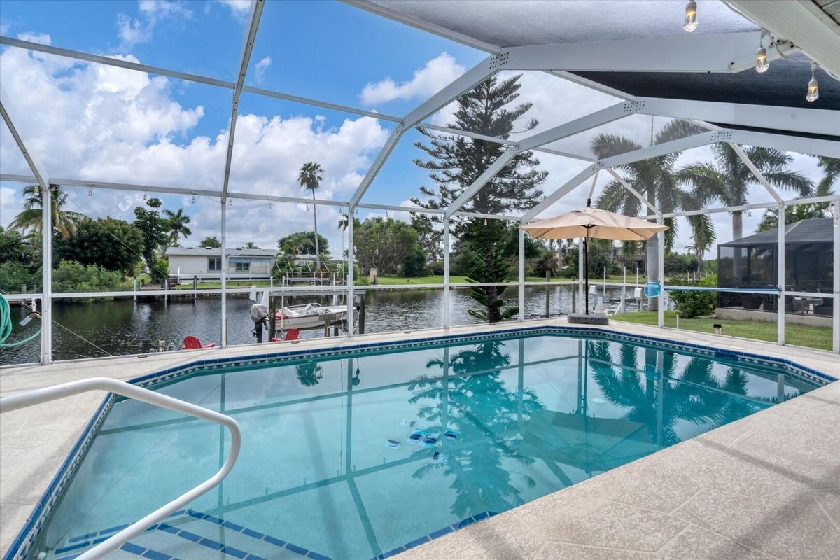 Sparkling pool overlooking the canal waters (Boat lift not available)