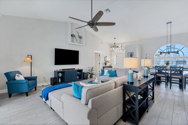 Living room with large, comfy sectional sofa and 75" Smart TV