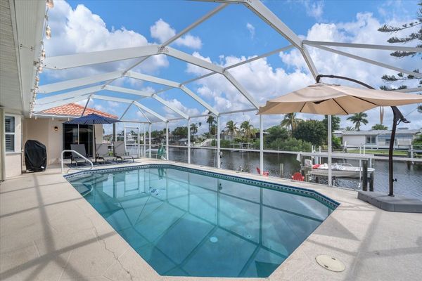 Sparkling pool overlooking canal.
Pool 26' x 14' x 6'D (Boat lift not available)