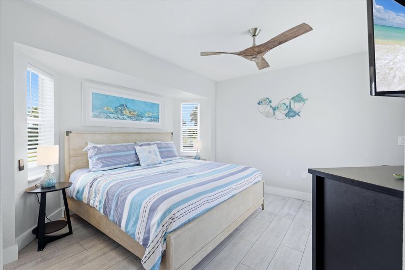 Bedroom #3 features a king bed, 48" Smart TV and lanai access