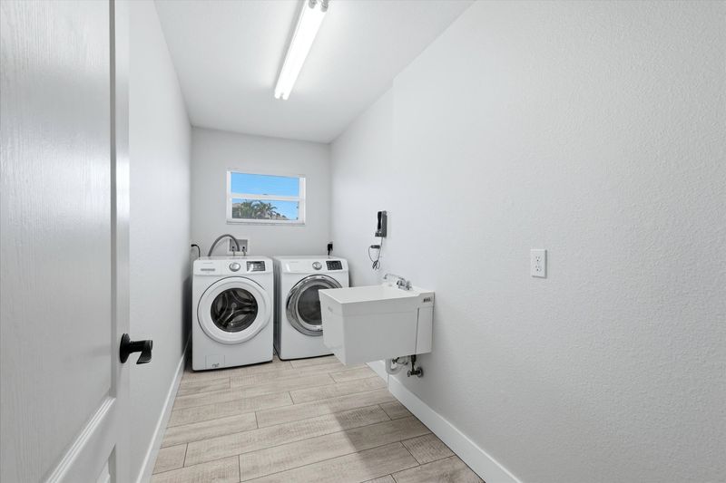 Laundry room with full-size washer & dryer