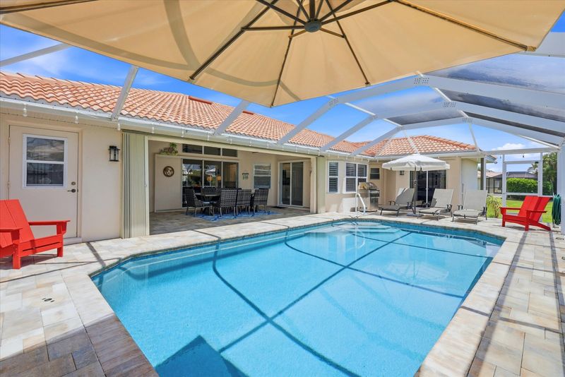 Sparkling pool overlooking canal. Pool 26' x 14' x 6'D
