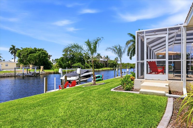 Beautiful backyard leading to canal, dock, and kayak launch (Boat lift not available)