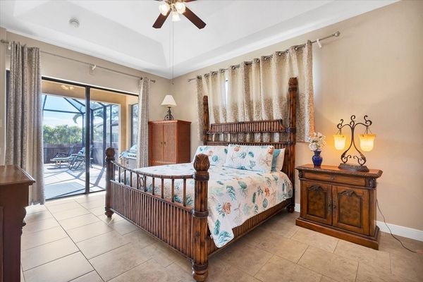 Primary bedroom with king bed and lanai access and ensuite