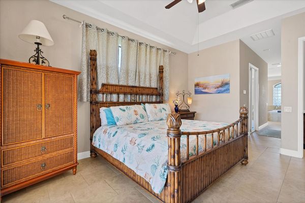 primary bedroom with king bed, patio access and ensuite