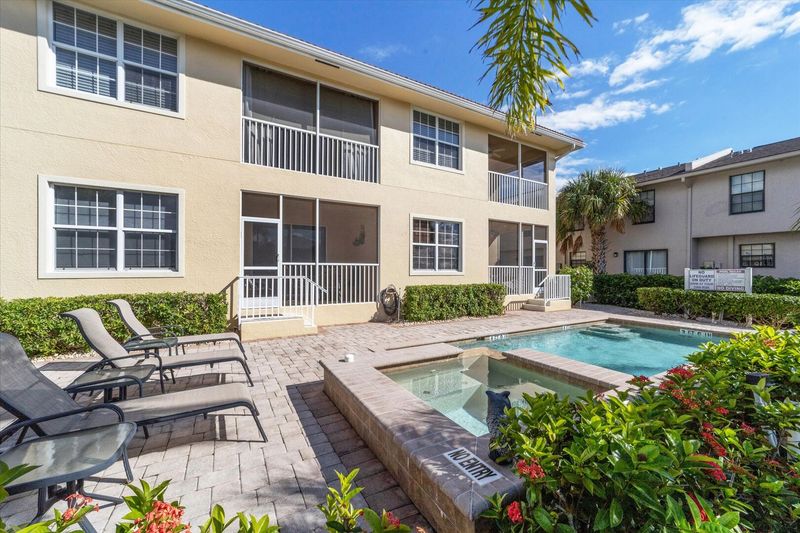1st floor condo overlooking pool & canal