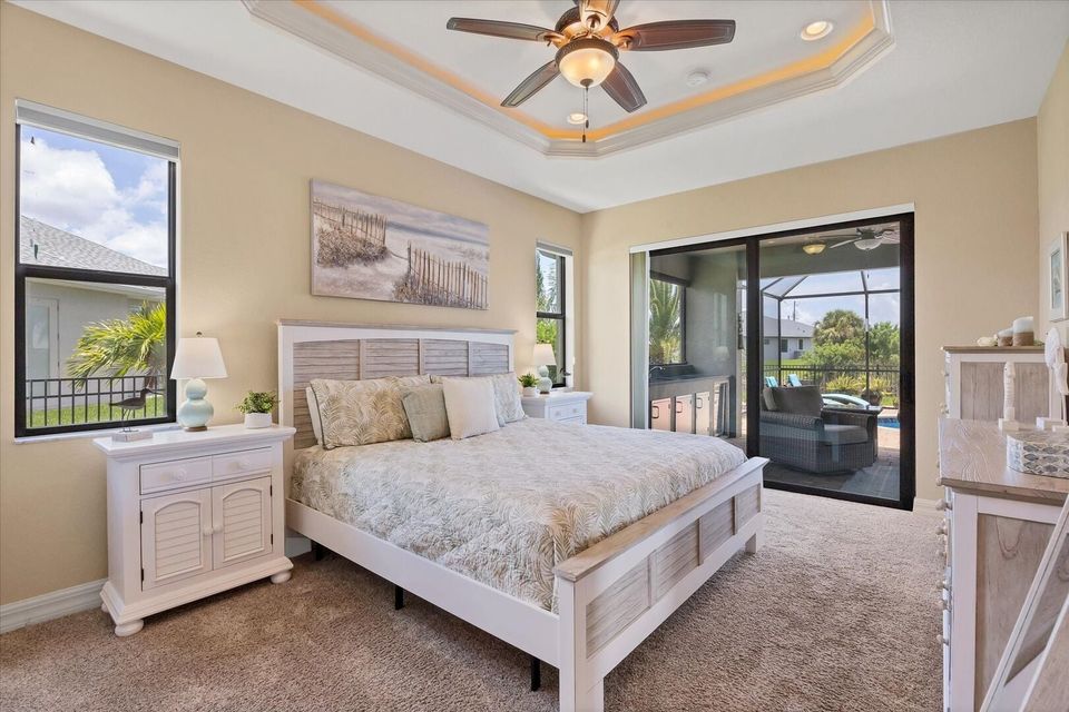 Primary bedroom with king bed, en suite, lanai access and 42" Smart TV