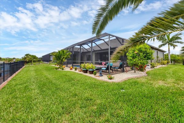 Private fenced yard leading to boat dock
