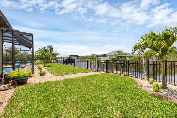 Private fenced yard leading to boat dock