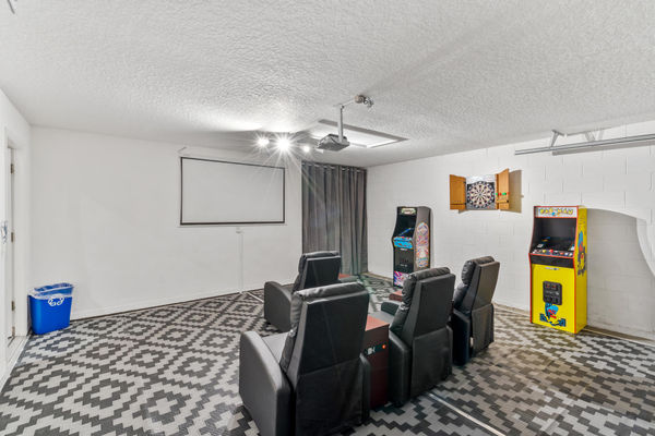 Theater Style Room w/ Projector and 80" Projection Screen/ Galaga Arcade Game/ Pac-Man Arcade Game