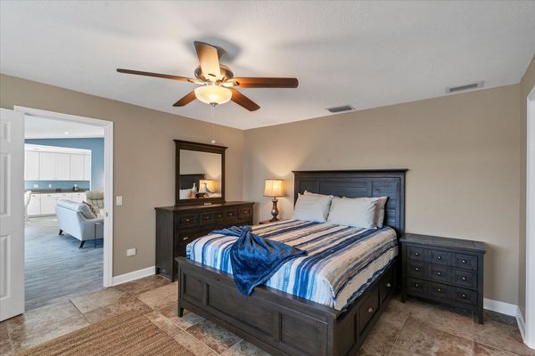 Primary bedroom features King bed, ensuite and 40-inch Smart TV