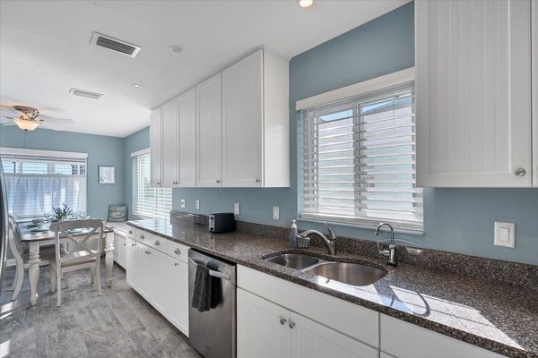 Fully-equipped kitchen with stainless-steel applainces and lots of countertop space