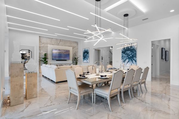 Dine in style at the formal dining table, which comfortably seats 10 guests for any occasion