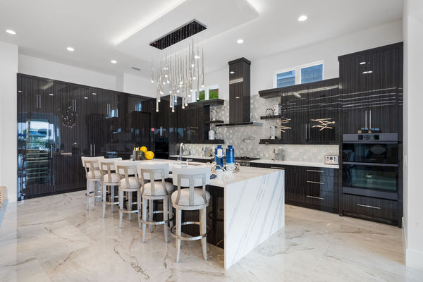 Sit down at the bar top whilst the family cooks up some home cooked meals