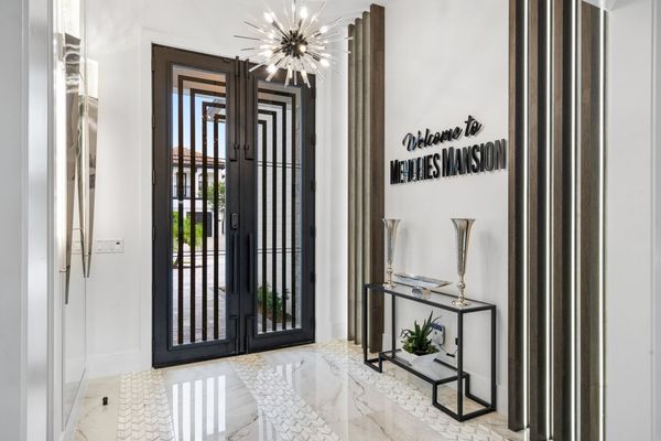 The front entrance to the home showcases the luxury of this magical villa