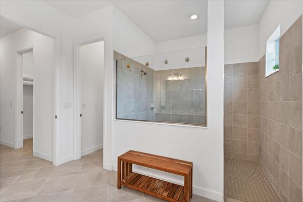 The primary bathroom has a huge walk-in shower