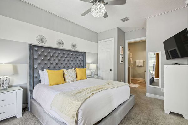 Relax and fall asleep to a favorite show in this cozy bedroom