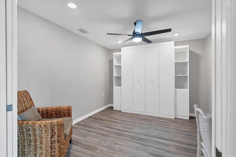 3rd room with office space and a full size Murphy bed.