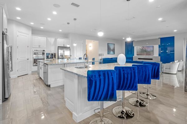 This bright and inviting kitchen beckons with its timeless charm and modern flair.
