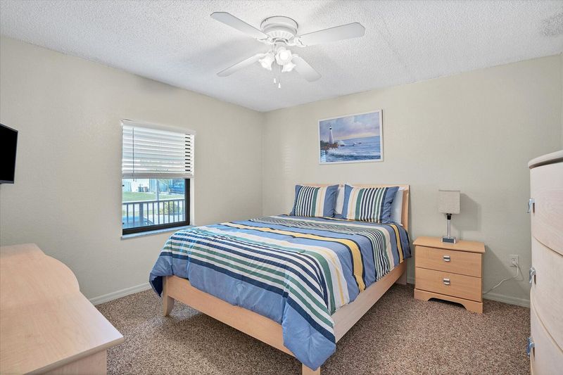 Guest bedroom has a queen bed