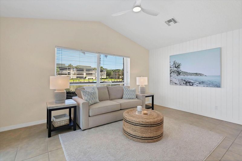 Guest bedroom 2 overlooks the canal & features a wet bar, lanai access and a queen sleeper sofa